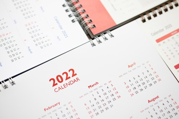 Conceito de reunião de compromisso de planejamento de negócios de plano de fundo de página de calendário 2022