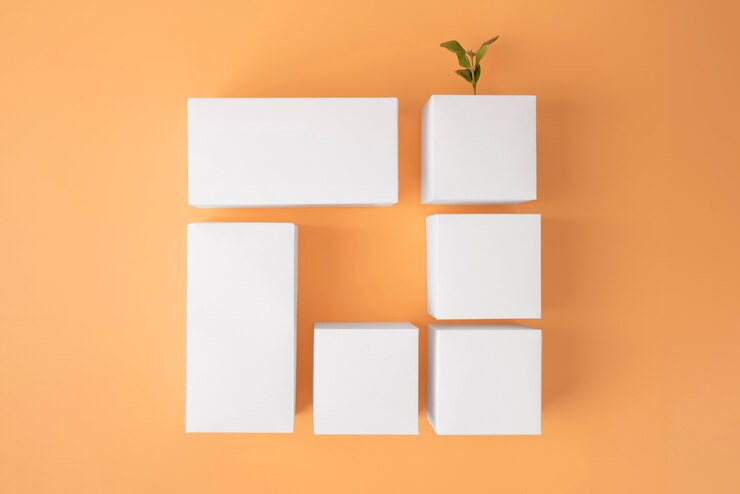Foto grátis conceito de sustentabilidade com plantas crescendo a partir de formas geométricas em branco