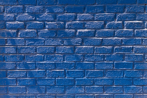 Copie a vista frontal da parede de tijolos azuis