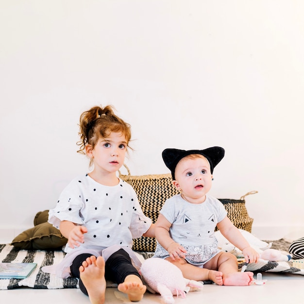 Cute girl and baby in headband