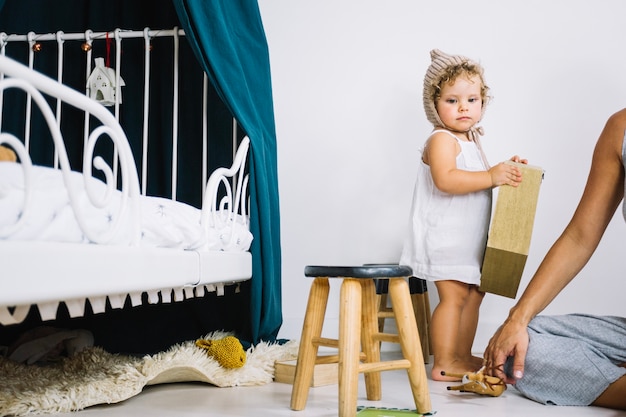 Cute girl holding box