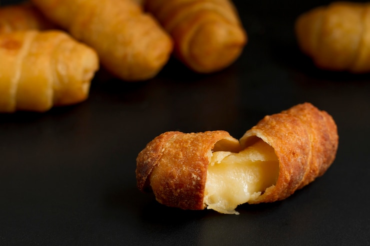 Foto grátis deliciosa composição de palitos de queijo venezuelano