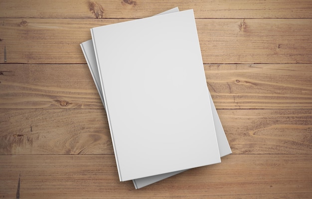 Foto grátis dois livros brancos de capa dura na superfície de madeira