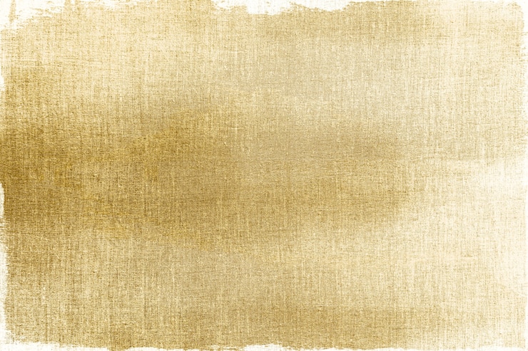 Foto grátis dourado pintado em um plano de fundo texturizado de tecido