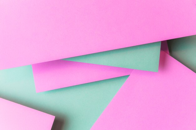 Em camadas de pano de fundo texturizado de papel-de-rosa e verde