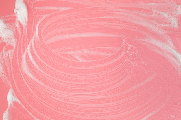 Foto grátis espuma de vista superior em fundo rosa