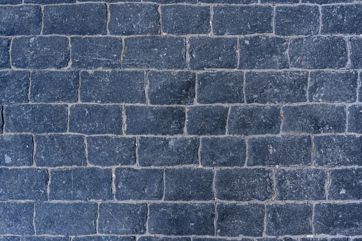 Foto grátis estrada pavimentada com paralelepípedos com cursos de borda na textura da calçada