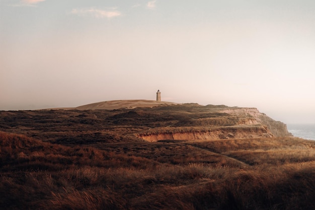 Farol Rubjerg Knude ao pôr do sol