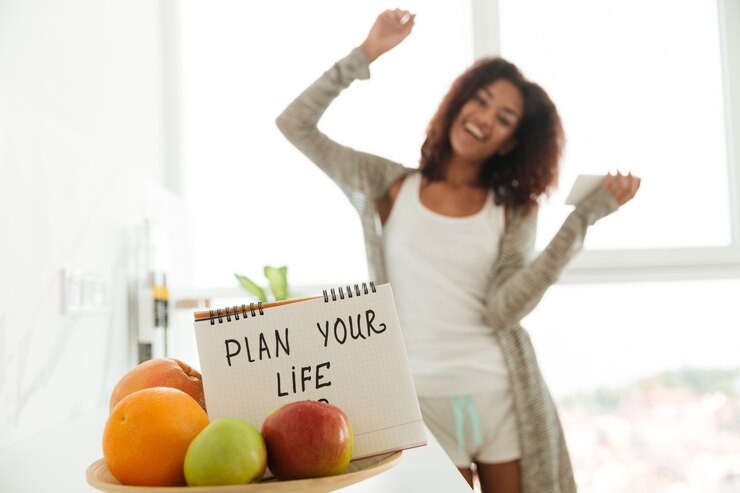 Foto grátis feche acima do caderno com o slogan 'planeje sua vida'