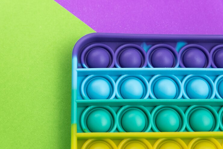 Foto grátis fidget pop it toy rainbow color - anti-stress, divertido e educacional