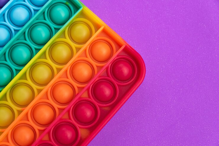 Foto grátis fidget pop it toy rainbow color - anti-stress, divertido e educacional