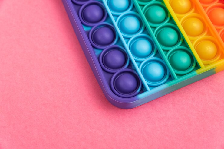 Foto grátis fidget pop it toy rainbow color - anti-stress, divertido e educacional