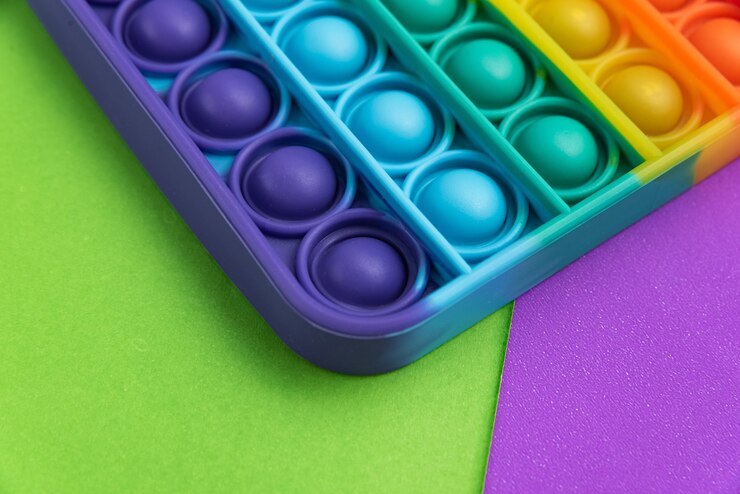 Foto grátis fidget pop it toy rainbow color - anti-stress, divertido e educacional