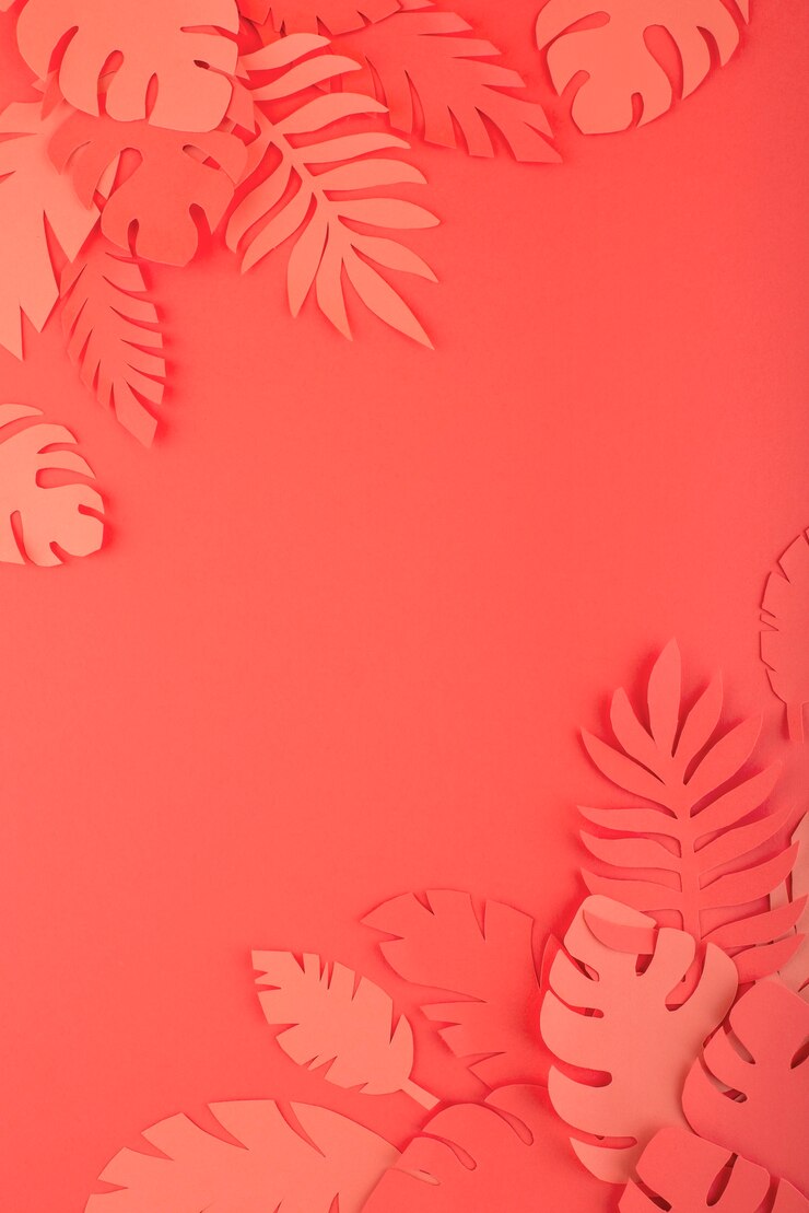 Foto grátis folhas de papel em fundo de coral
