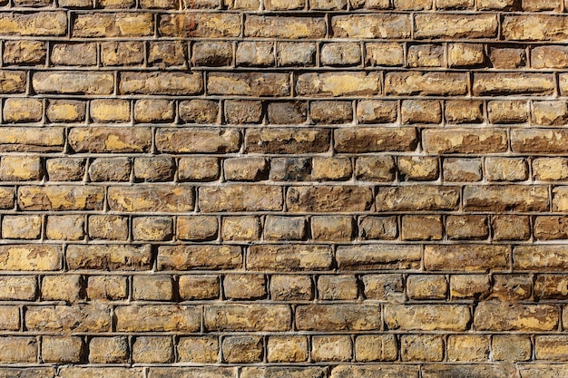Foto aproximada de uma parede feita de fundo de textura de pedras retangulares