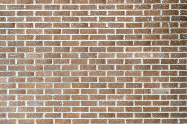 Foto aproximada de uma parede feita de tijolos retangulares