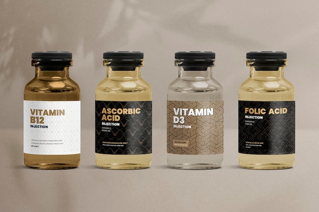 Foto grátis frascos de vidro de injeção de vitamina com rótulos estampados luxuosos