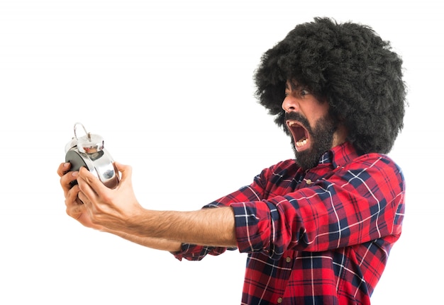 Frustrado, afro, homem, segurando, vintage, relógio