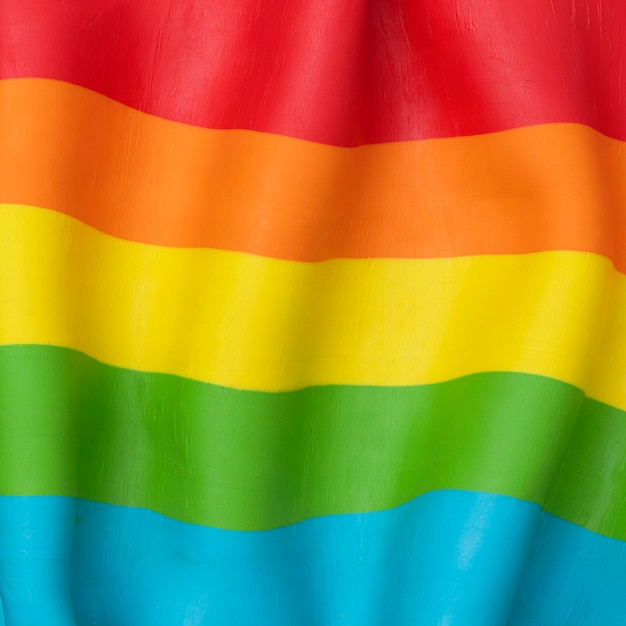 Fundo da bandeira do arco-íris LGBTQ + em textura de argila plasticina DIY