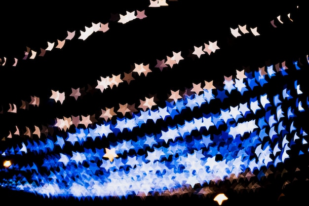 Fundo de bokeh com luzes em forma de estrela