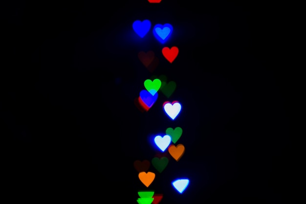 Fundo de luzes coloridas com corações