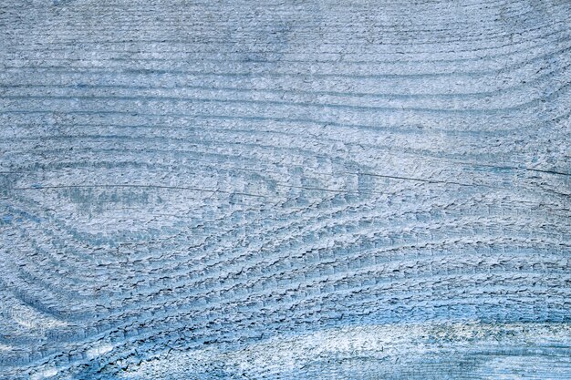 Fundo de madeira azul com linhas horizontais e nó em forma de olho