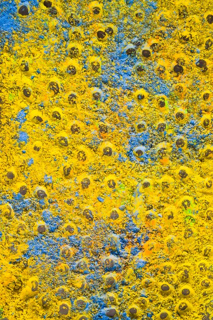 Fundo de pó de holi abstrato azul e amarelo