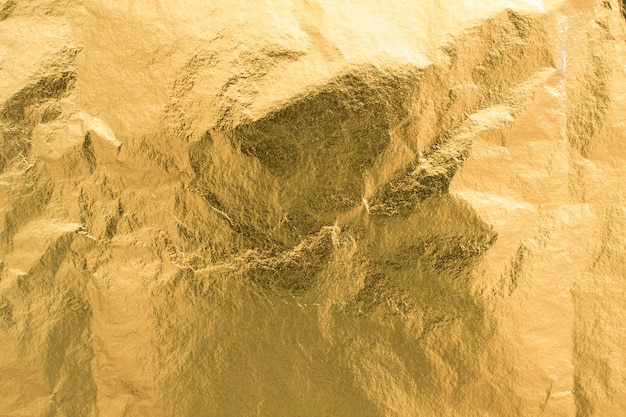 Fundo de textura de folha dourada, elemento de decoração de papel de embrulho brilhante