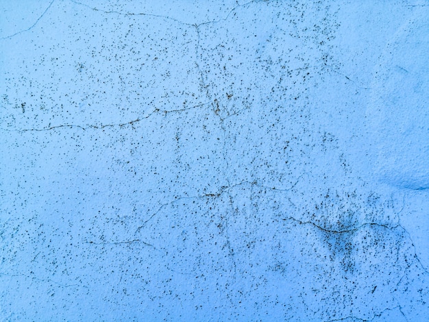 Fundo de textura de parede azul com rachaduras