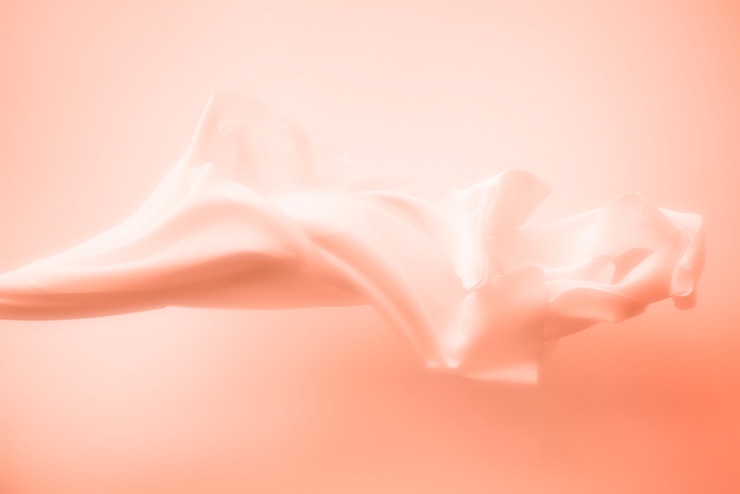 Foto grátis fundo de textura de tecido satinado de pêssego