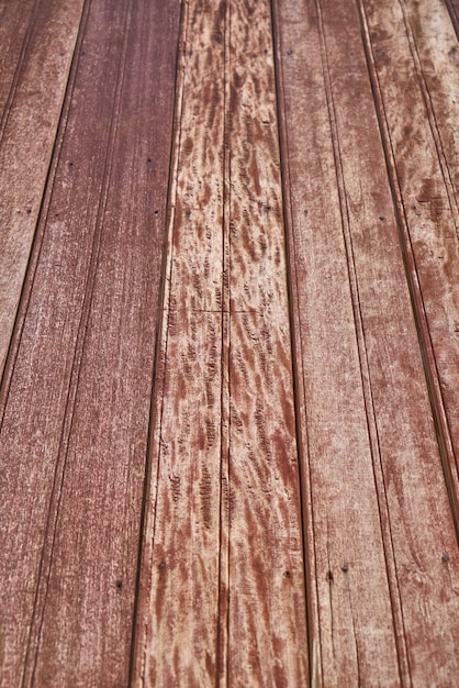 Foto grátis fundo do teste padrão de madeira sujo vermelho