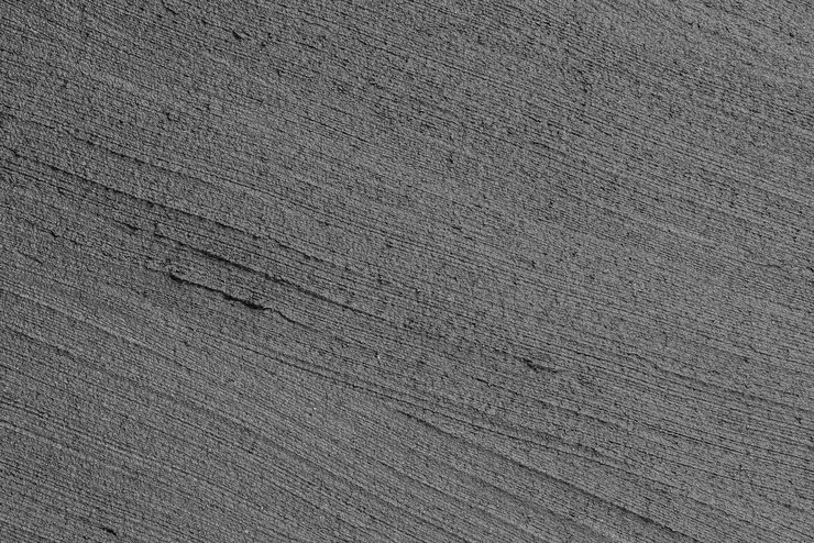 Foto grátis fundo texturizado de concreto com padrões cinzentos