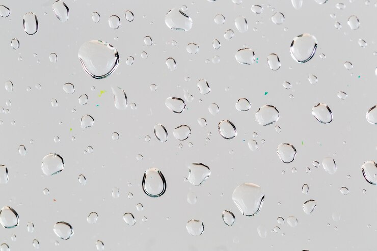 Foto grátis gotas de close-up na superfície branca
