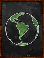 Foto grátis green earth on blackboard globe