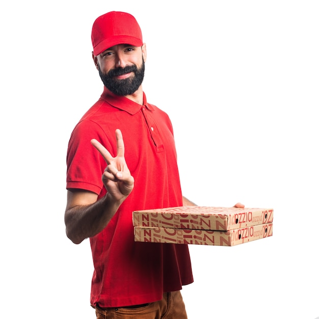 Foto grátis homem de entrega de pizza fazendo um gesto de vitória