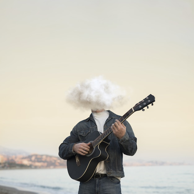 Foto grátis homem de vista frontal tocando guitarra