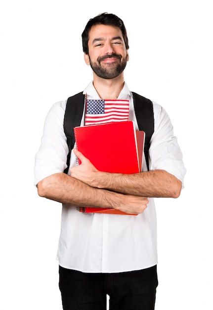 Homem estudante que segura uma bandeira americana