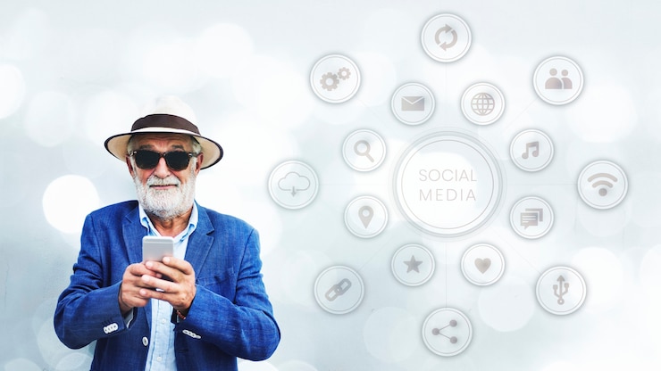 Foto grátis homem idoso elegante usando seu smartphone