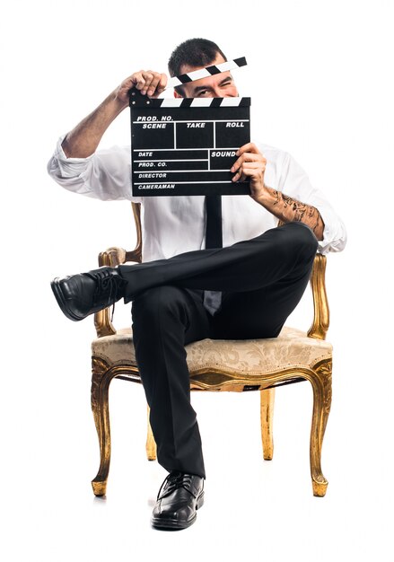 Homem negócios segurando um clapperboard