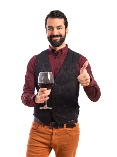 Foto grátis homem, vestindo, colete, segurando, vinho, vidro