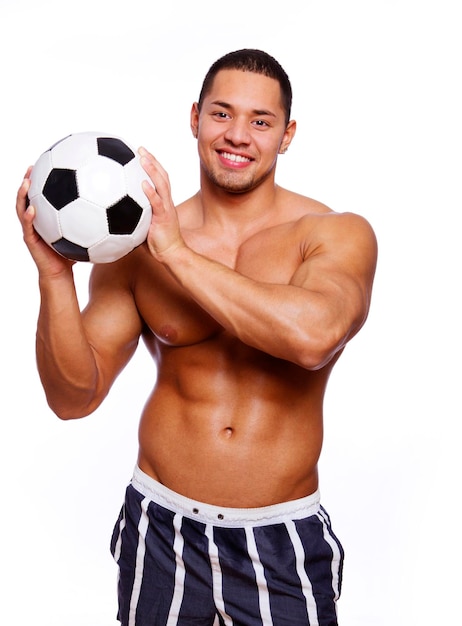 Foto grátis imagem de homem musculoso posando no estúdio com bola