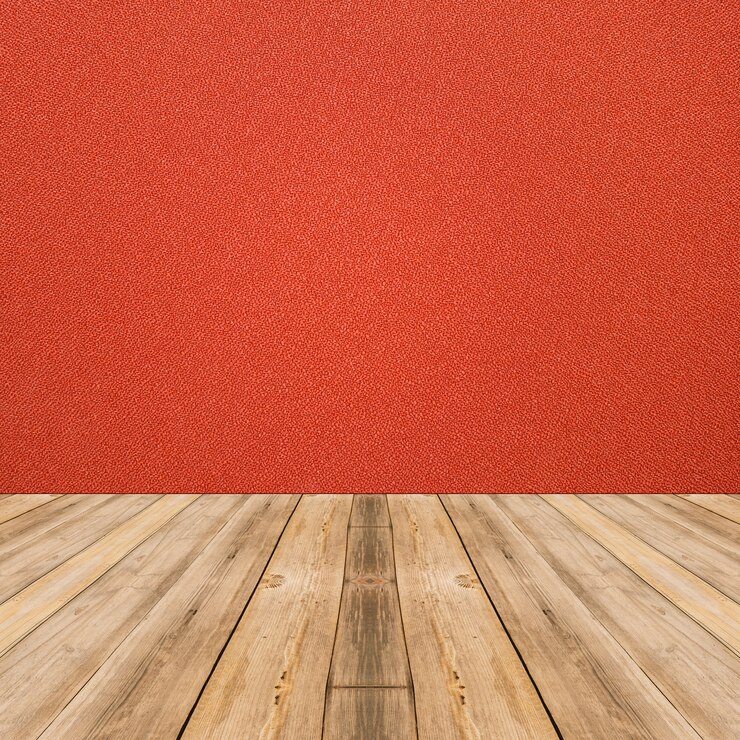 Foto grátis interior do quarto com parede de pano vermelho e fundo do chão de madeira