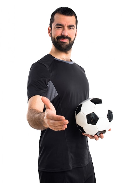 Foto grátis jogador de futebol fazendo um acordo