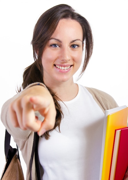 Jovem estudante com seus livros sobre fundo branco