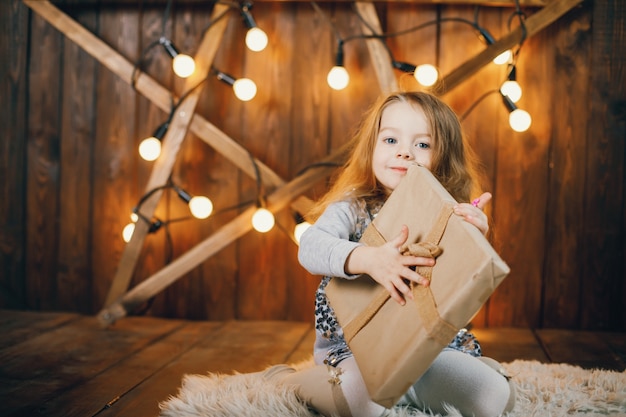 Little girl opening presents