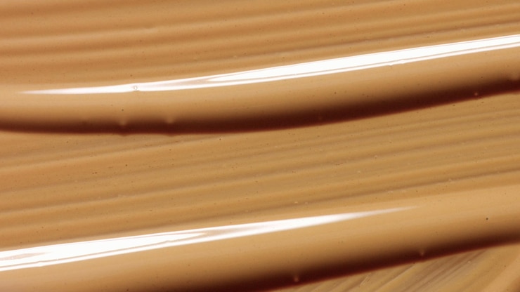 Foto grátis manchas de textura de base de maquiagem líquida vista superior de textura de macro cosméticos