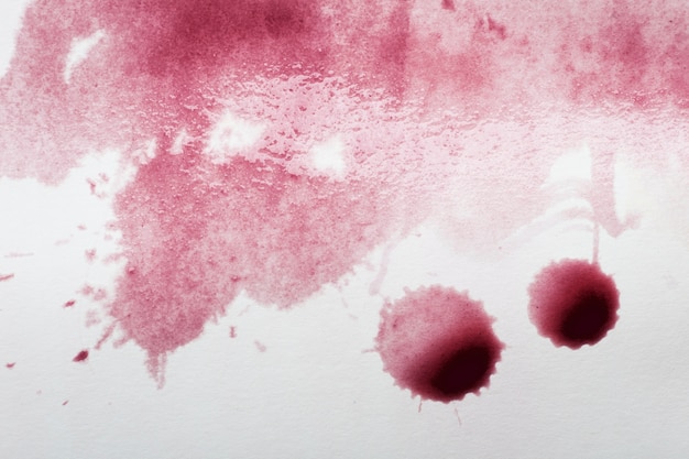 Foto grátis manchas de vinho tinto em material branco