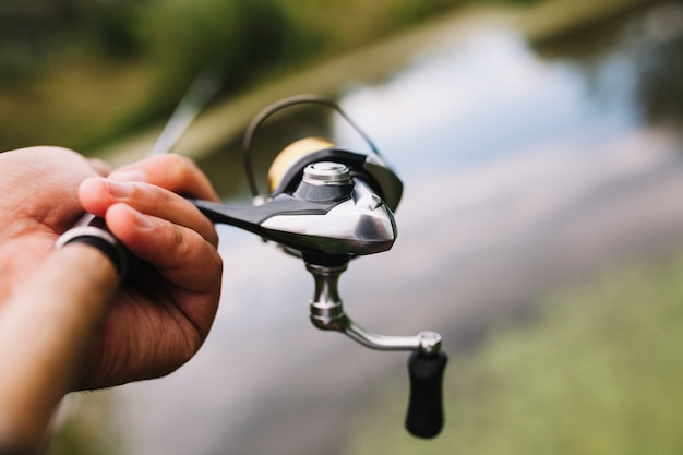 Mão pescador, segurando, cana de pesca