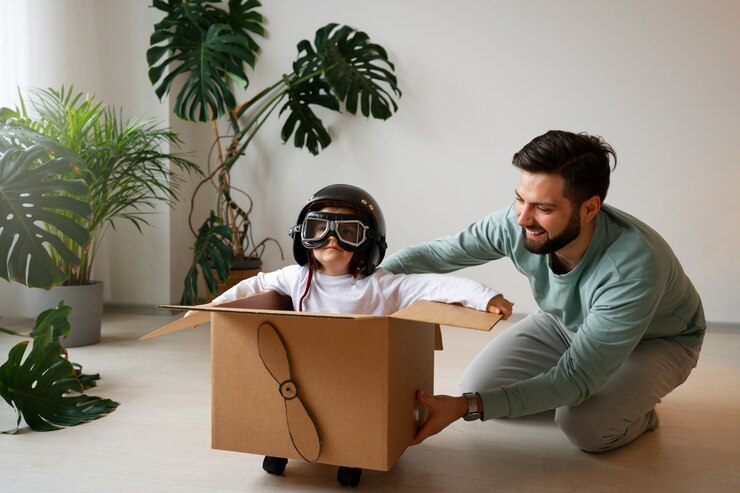 Foto grátis menino de tiro completo e pai brincando juntos