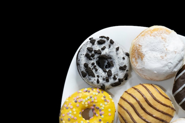 Mistura de donuts doces multicoloridos Foto Premium
